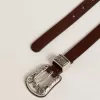 Curea din piele maro închis pentru femei, cu cataramă argintie decorată Curea din piele maro închis pentru femei, cu cataramă argintie decorată