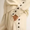 Hanorac alb pentru femei, cu fermoar, cu dungă albă și stele negre Hanorac alb pentru femei, cu fermoar, cu dungă albă și stele negre