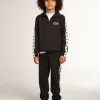Pantaloni de jogging albastru închis cu dungă albă și stele contrastante Pantaloni de jogging albastru închis cu dungă albă și stele contrastante