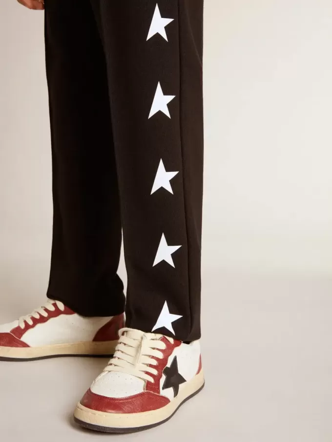 Pantaloni de jogging negri pentru băieți, cu stele albe Pantaloni de jogging negri pentru băieți, cu stele albe