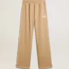 Pantaloni de jogging pentru femei, de culoare bej deschis, cu logo alb Pantaloni de jogging pentru femei, de culoare bej deschis, cu logo alb