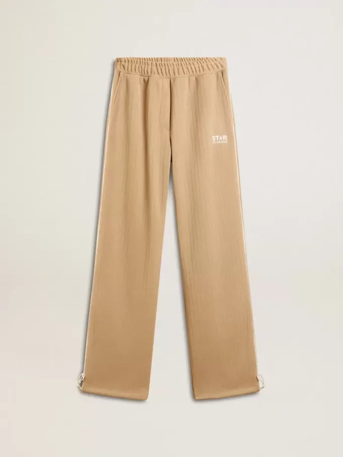 Pantaloni de jogging pentru femei, de culoare bej deschis, cu logo alb Pantaloni de jogging pentru femei, de culoare bej deschis, cu logo alb