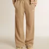 Pantaloni de jogging pentru femei, de culoare bej deschis, cu logo alb Pantaloni de jogging pentru femei, de culoare bej deschis, cu logo alb