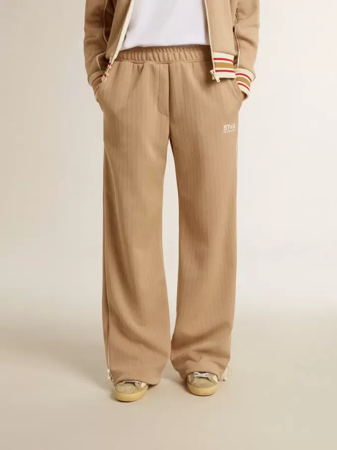 Pantaloni de jogging pentru femei, de culoare bej deschis, cu logo alb Pantaloni de jogging pentru femei, de culoare bej deschis, cu logo alb