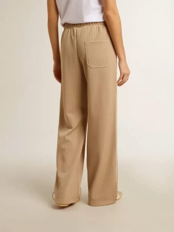 Pantaloni de jogging pentru femei, de culoare bej deschis, cu logo alb Pantaloni de jogging pentru femei, de culoare bej deschis, cu logo alb