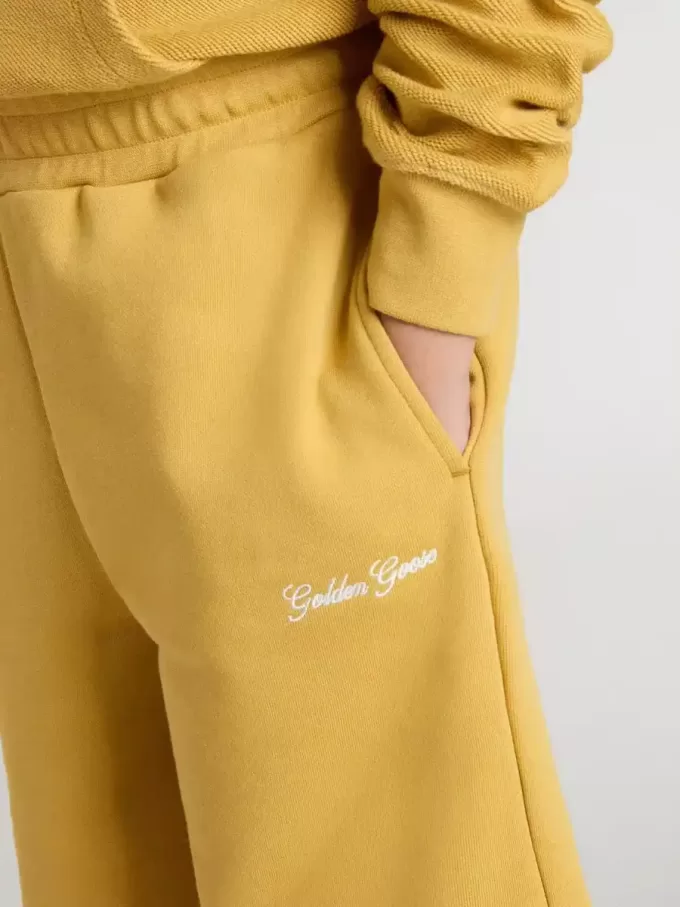 Pantaloni scurți de jogging pentru copii, de culoare galben ocru, cu broderie