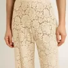 Pantaloni transparenți din dantelă de culoare crem pentru femei Pantaloni transparenți din dantelă de culoare crem pentru femei