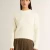 Pulover cu guler rotund pentru femei, din lână merino albă, cu cristale pe toată suprafața Pulover cu guler rotund pentru femei, din lână merino albă, cu cristale pe toată suprafața