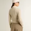 Pulover scurt cu guler rotund din lână bej, cu cristale pe toată suprafața Pulover scurt cu guler rotund din lână bej, cu cristale pe toată suprafața