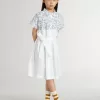 Rochie cămașă pentru fete din pânză de bumbac albă, cu imprimeu nautic albastru și bordură albă Rochie cămașă pentru fete din pânză de bumbac albă, cu imprimeu nautic albastru și bordură albă