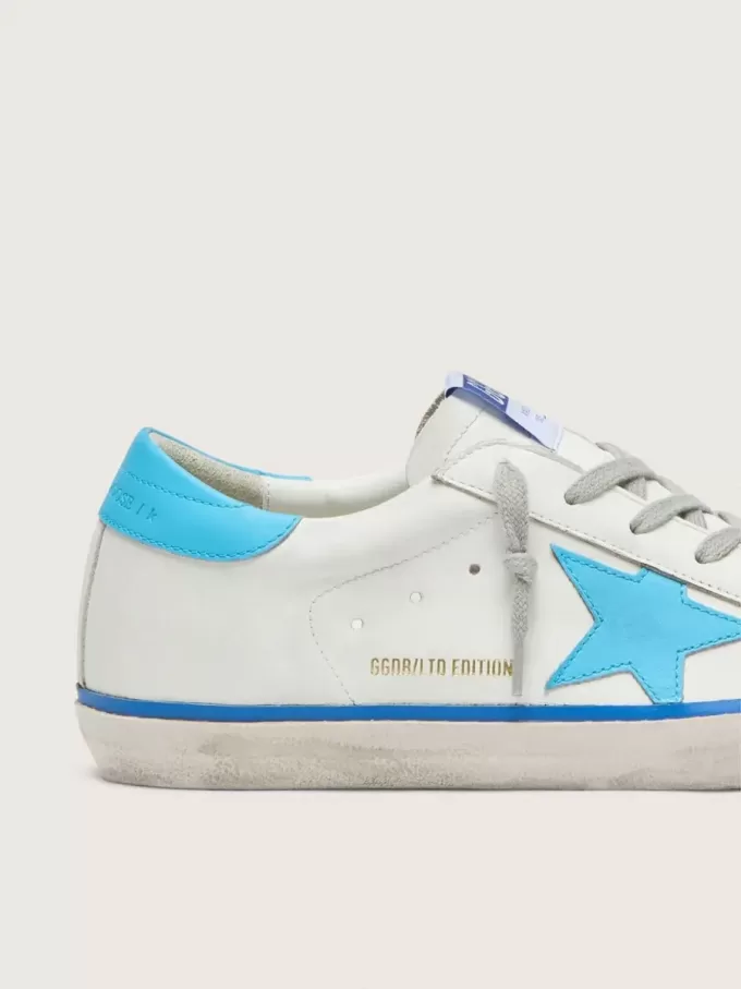 Super-Star LTD pentru femei, din piele albă, cu stea și călcâi din piele albastră deschisă Super-Star LTD pentru femei, din piele albă, cu stea și călcâi din piele albastră deschisă