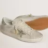 Super-Star LTD pentru femei, din piele nappa de culoare ivoriu, cu stea strălucitoare din platină și bandă pe călcâi Super-Star LTD pentru femei, din piele nappa de culoare ivoriu, cu stea strălucitoare din platină și bandă pe călcâi