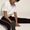 Tricou alb pentru femei, cu logo argintiu strălucitor și stea Tricou alb pentru femei, cu logo argintiu strălucitor și stea