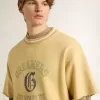 Tricou oversized din bumbac galben pentru bărbați, cu imprimeu albastru Tricou oversized din bumbac galben pentru bărbați, cu imprimeu albastru